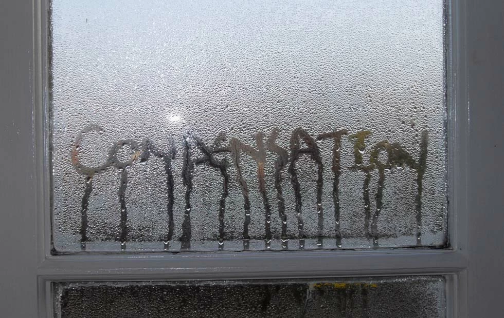 Condensation in windows with water dripping downwards