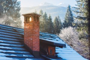 mountain cottage chimney in winter Damp Chimney