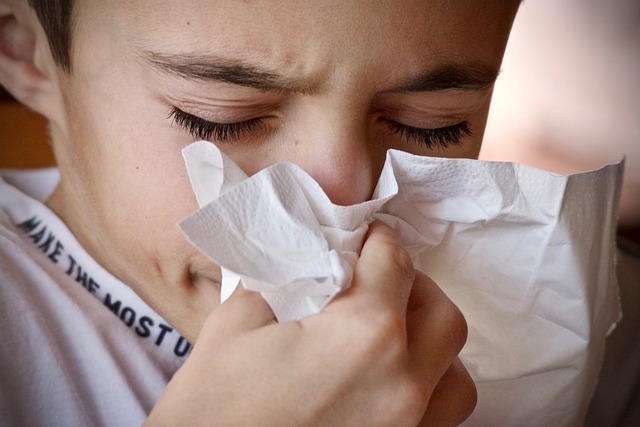 boy with a runny nose because of mould