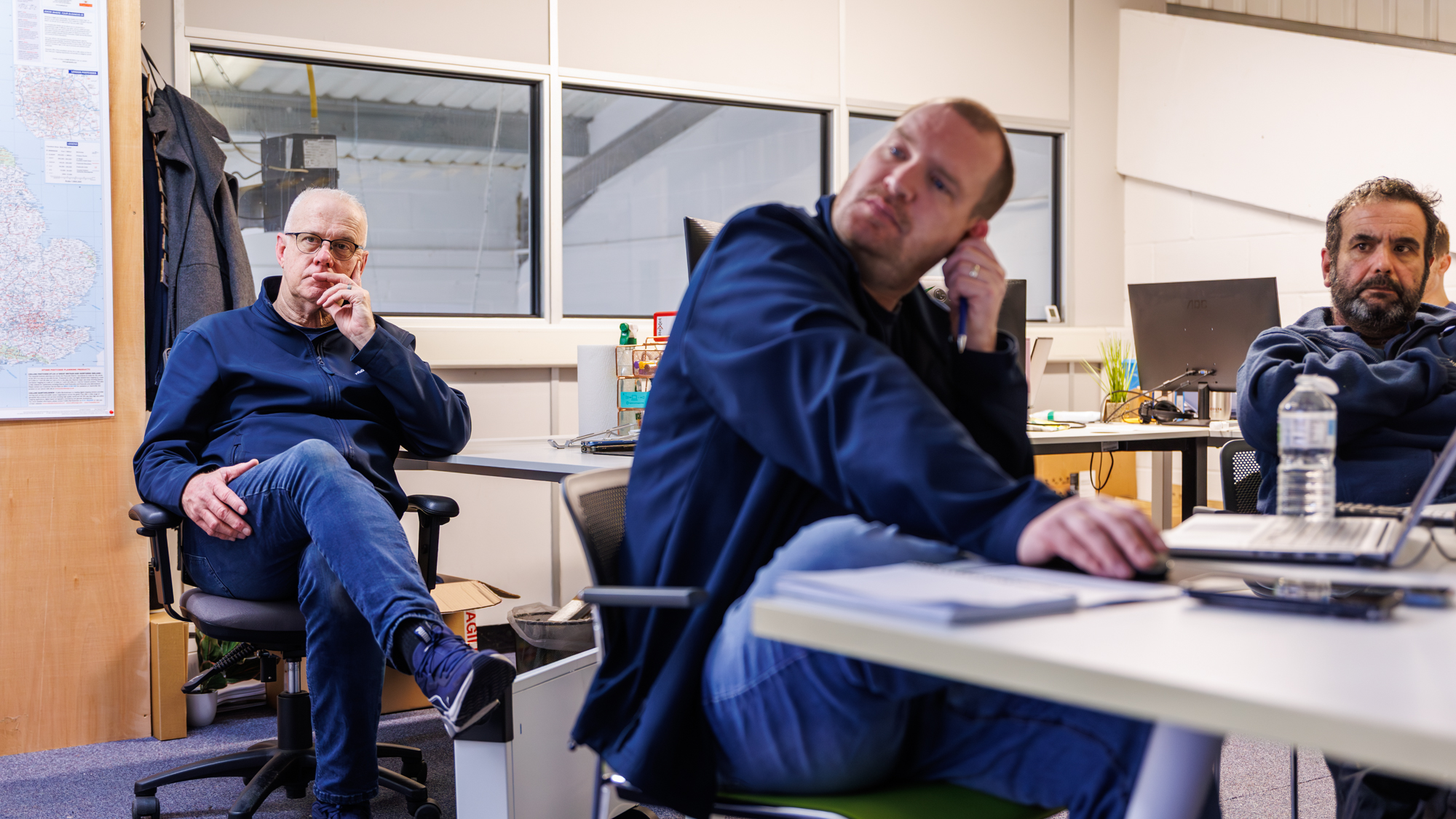Advanced Damp team members discussing a project