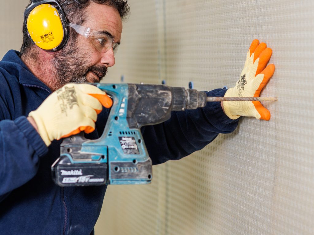 Cavity drain membrane installation on a below-ground commercial project