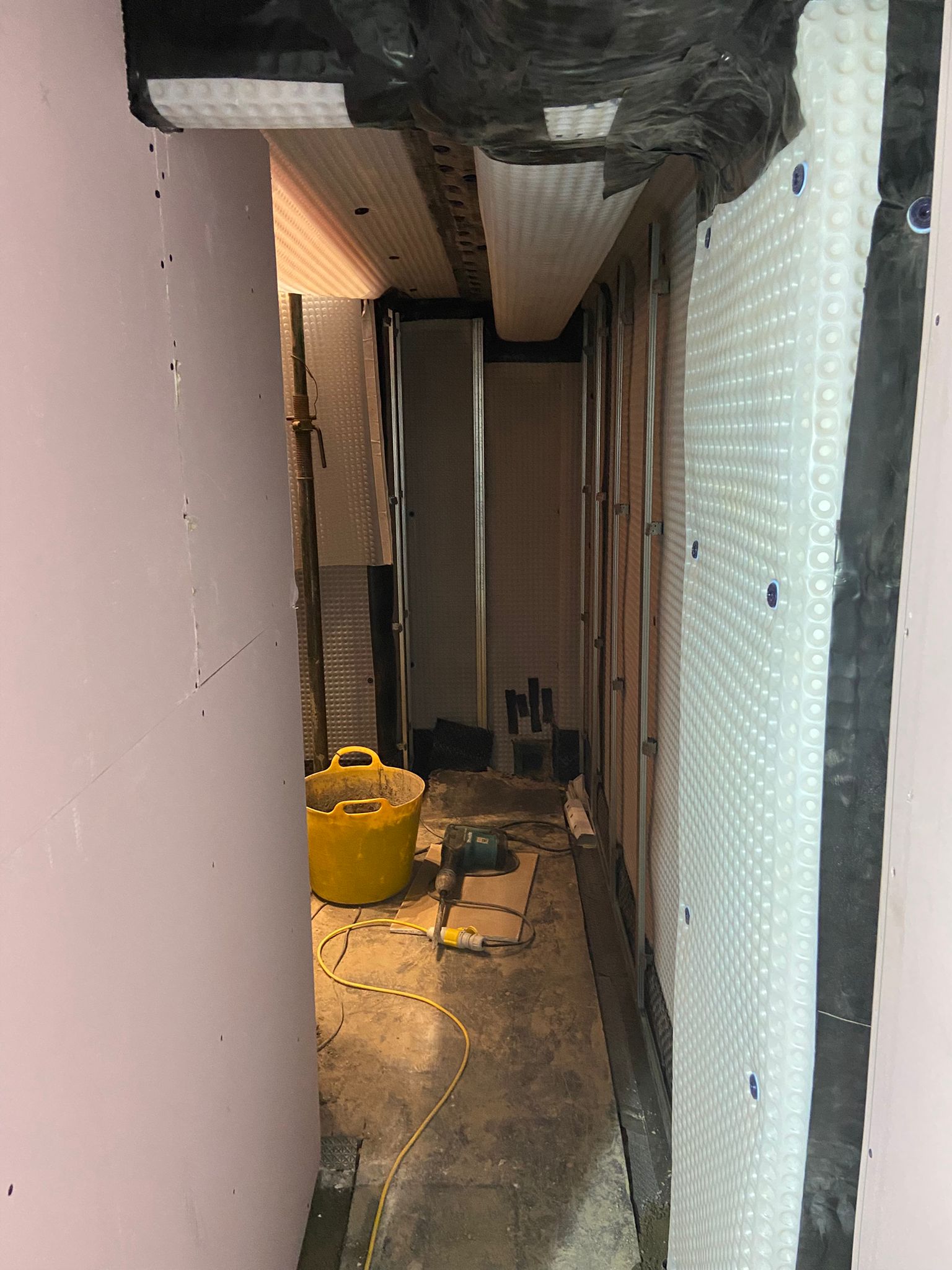 Photo from Sam Fitzgerald 2 Cavity drain membrane and perimeter drainage installed to the commercial basement walls and floor
