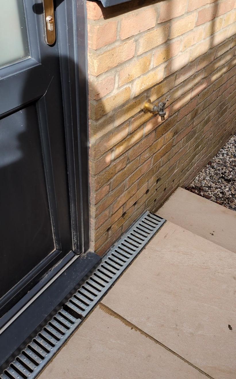 Completed wall membrane and floor screed in a structural waterproofing project in Fulham