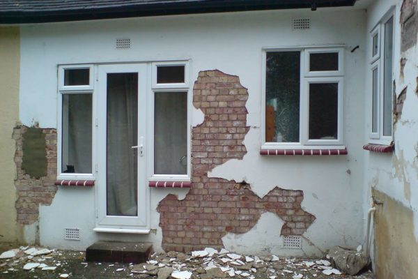 damp damage exterior wall damp damage on exterior wall. The wall is having work done to remove the plaster and install a damp treatment