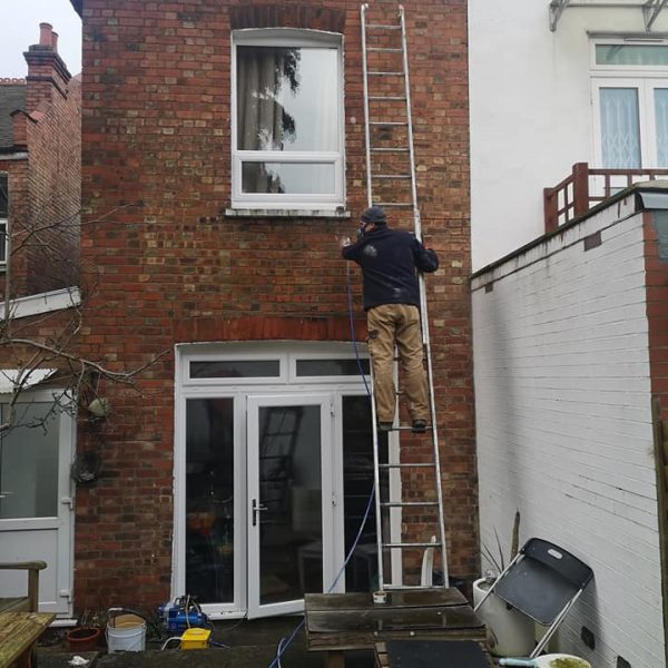waterproof-coating-walls Advanced Damp worker applying waterproofing wall coating to property